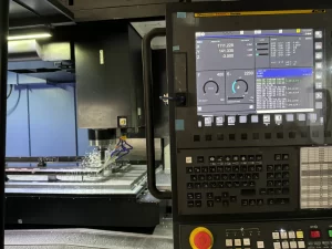Close-up of CNC control panel with digital readout during machining