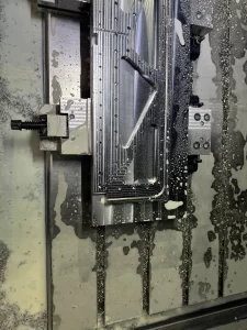 Close-up of milled aluminium part with coolant traces