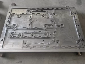 CNC drill bit making detailed cuts in aluminium component