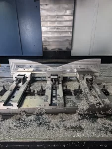 CNC machined aluminium part with metal shavings
