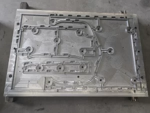 CNC machined aluminium plate with detailed toolpath patterns