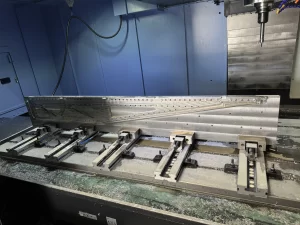 CNC milled metal part clamped using multiple vises