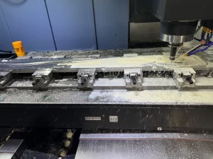 CNC milling with metal chips on machine bed