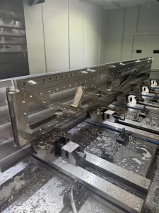 Detailed shot of CNC milled aluminium with bolt holes