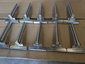 Drilled metal fixture part on cnc setup