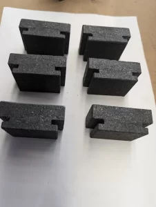 grooved black blocks positioned in two vertical rows