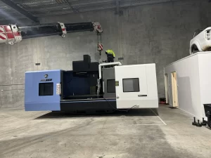 Industrial CNC machine setup inside factory under installation