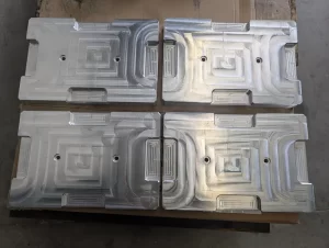 Machined cylindrical metal parts on pallet