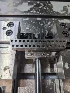 precision machined aluminium blocks on cardboard