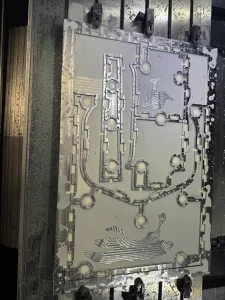 Precision machined aluminium part with complex cut-outs