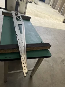 Precision machined metal part on inspection table