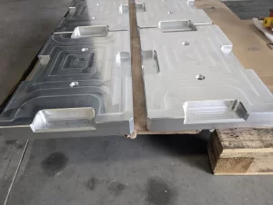 Top view of four CNC machined plates