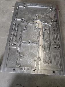 Top view of machined metal part with circular patterns