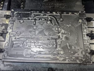 Top view of machined plate showing detailed toolpath patterns